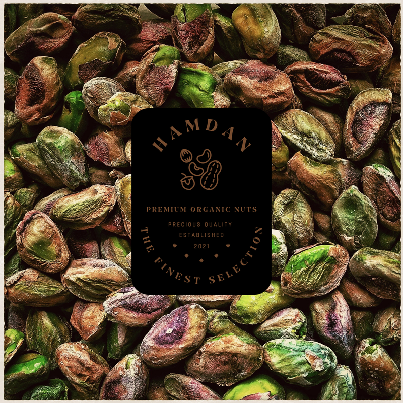 Shelled raw and salted roasted pistachios showing bright green kernels and texture